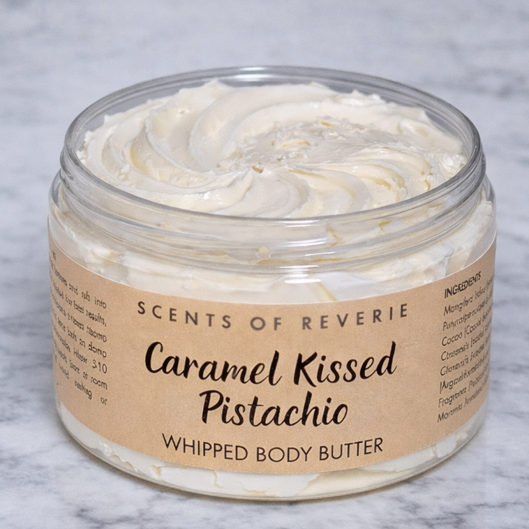 Jar of Scents of Reverie Caramel Kissed Pistachio whipped body butter on a marble background
