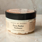 Jar of Scents of Reverie Cocoa Butter Cashmere Whipped Body Butter on a marble surface