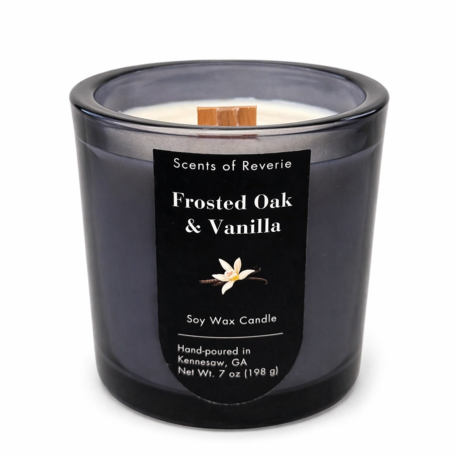 Frosted Oak & Vanilla candle in a black container on a white background