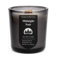 Black candle labeled 'Midnight Noir' by Scents of Reverie on a white background