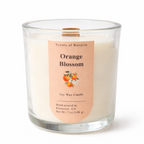Candle with an 'Orange Blossom' label on a white background