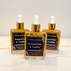 Three bottles of Frosted Oak & Vanilla perfume on a marble surface with a light background