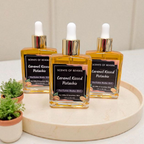 Three bottles of 'Caramel Kazed Potashu' on a wooden tray with a neutral background