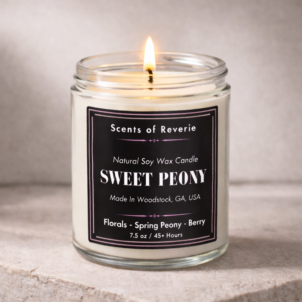 Candle labeled 'Sweet Peony' by Scents of Reverie on a neutral background