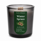 A Scents of Reverie Winter Spruce soy wax candle in a dark gray glass jar with a green label, shown on a white background.