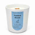 Candle with a blue label titled 'Nautical Dream' by Scents of Reverie on a white background.